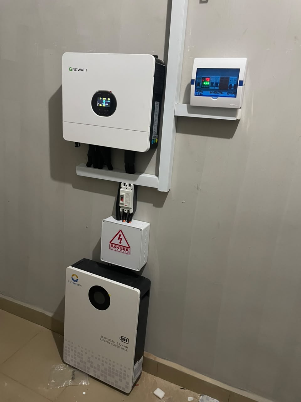 Wall-mounted hybrid inverter with lithium battery installed by LEVAN COCMO LLP