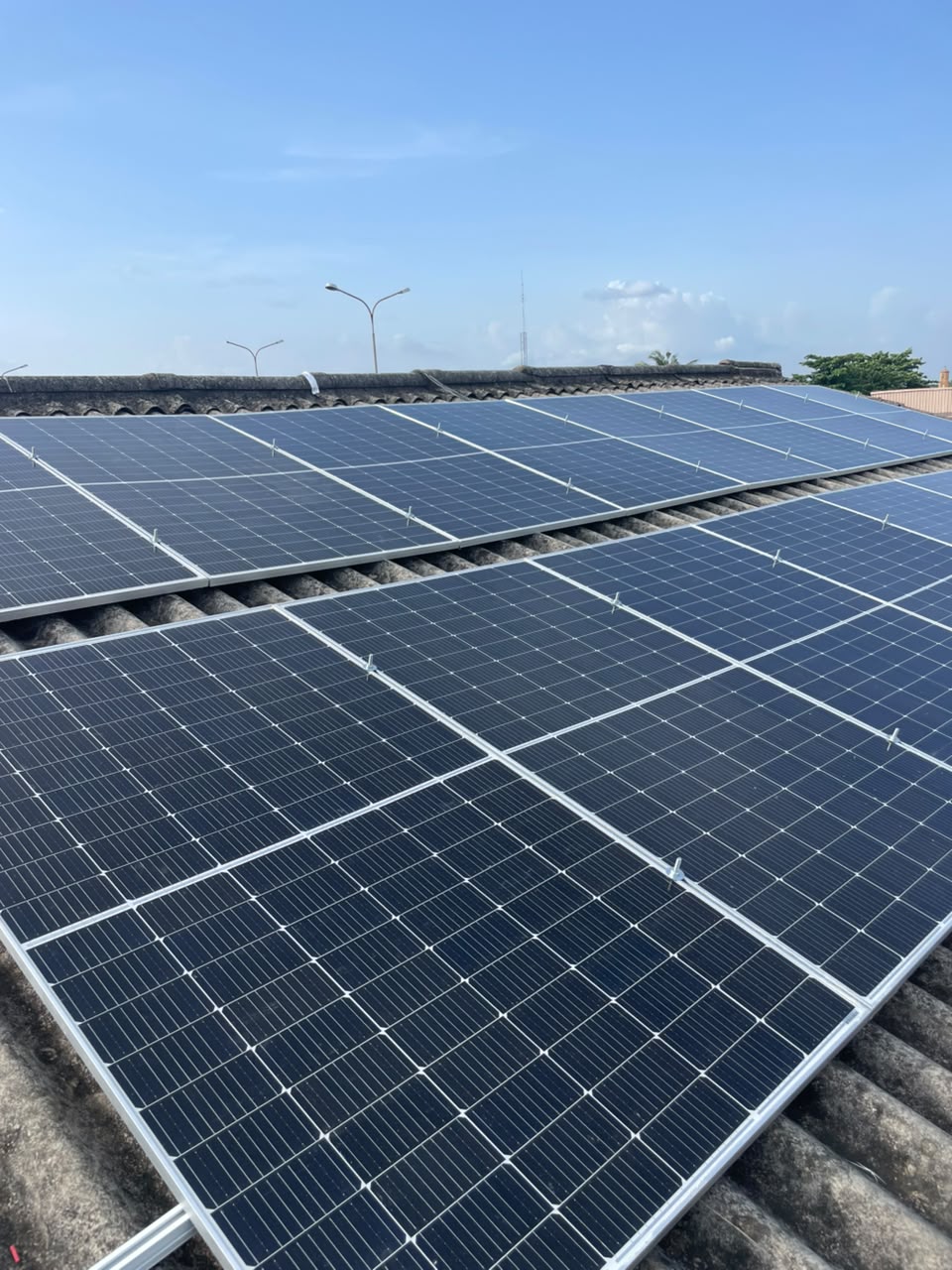 Rooftop solar panel array installed by LEVAN COCMO LLP under a clear sky
